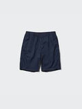 Dark blue shorts with an elastic waistband, laid flat on a white background.